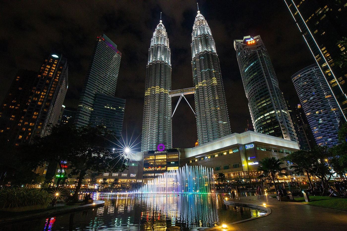 The Petronas Twin Towers lit at night in central Kuala Lumpur